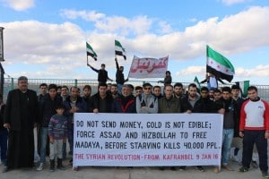 Bewohner Kafranbels fordern, dass das Leiden in Syrien ein Ende hat.